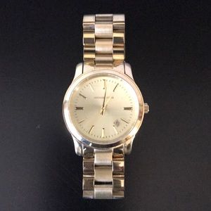 Michael Kors “Runway” bracelet watch in gold.